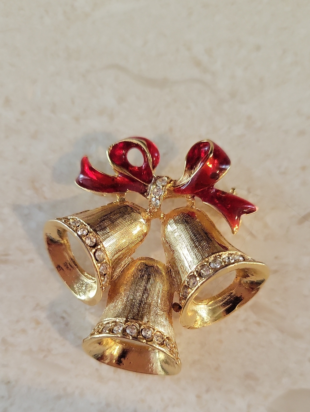 Gold-tone Holiday Bells Brooch with Red Enamel Bow